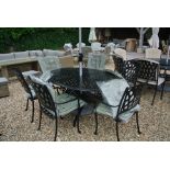 A Bramblecrest Rome 167cm x 112cm elliptical table with six stacking armchairs with cushions,