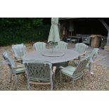 A Bramblecrest Turin 196cm x 147cm elliptical table with lazy susan,