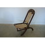 A 19th century Chinese folding hardwood chair,