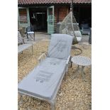 A Bramblecrest Portofino lounger with cushion and coffee table