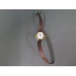 A silver cased Ladies wristwatch on leather strap,