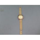 A 9ct yellow gold cased Longines wristwatch, champagne coloured dial, automatic movement,