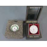 A base metal pocket watch with enamel dial - Width 48mm - working - in a silver fronted case and