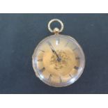 An 18ct yellow gold cased open faced pocket watch Roman numerals to gold engraved dial - total