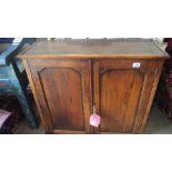 An oak two door wall hanging cupboard - Height 64cm x 71cm x 27cm