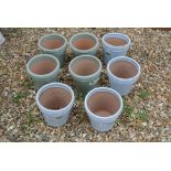 Eight glazed new garden pots