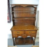 An antique style oak veneered dresser - Height 177cm x 104cm x 46cm