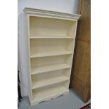 A modern cream painted bookcase - Height 155cm x 85cm x 27cm