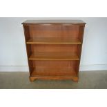 A reproduction yew wood bookcase with adjustable shelves - 92cm x 28cm x 107cm