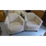 A pair of faux suede upholstered tub chairs