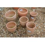 Six terracotta plant pots