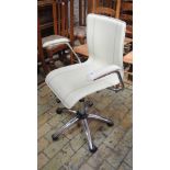 A cream adjustable office chair