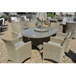 A Bramblecrest Cotswold 170cm x 120cm oval table with six armchairs, lazy susan, cushions,