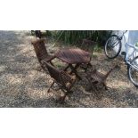 A child's garden table and four chairs - 60cm x 68cm x 50cm high