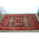 A hand knotted Baluchi rug - 2.36m x 1.