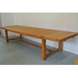 A large oak dining table with two additional end leaves - Height 76cm x 100cm x 381cm extended x