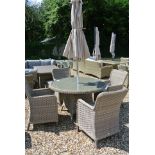 A Bramblecrest Patagonia four seat dining set with parasol and base- One bent chair