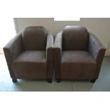 A pair of faux suede upholstered tub chairs