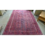 A hand knotted woolen Baluchi rug - 2.85m x 1.