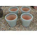 Four glazed new garden pots