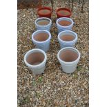 Eight glazed new garden pots