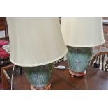 A pair of lamps with vase bases the porcelain vases decorated with butterflies