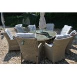 A Bramblecrest Oakridge 220cm x 150cm oval table with six armchairs and two recliners, lazy susan,