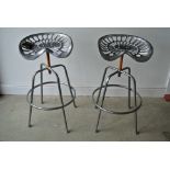 A pair of modern Ascalon tractor seat bar stools