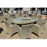 A Bramblecrest Cotswold 220cm x 150cm oval table with eight armchairs, lazy susan, cushions,