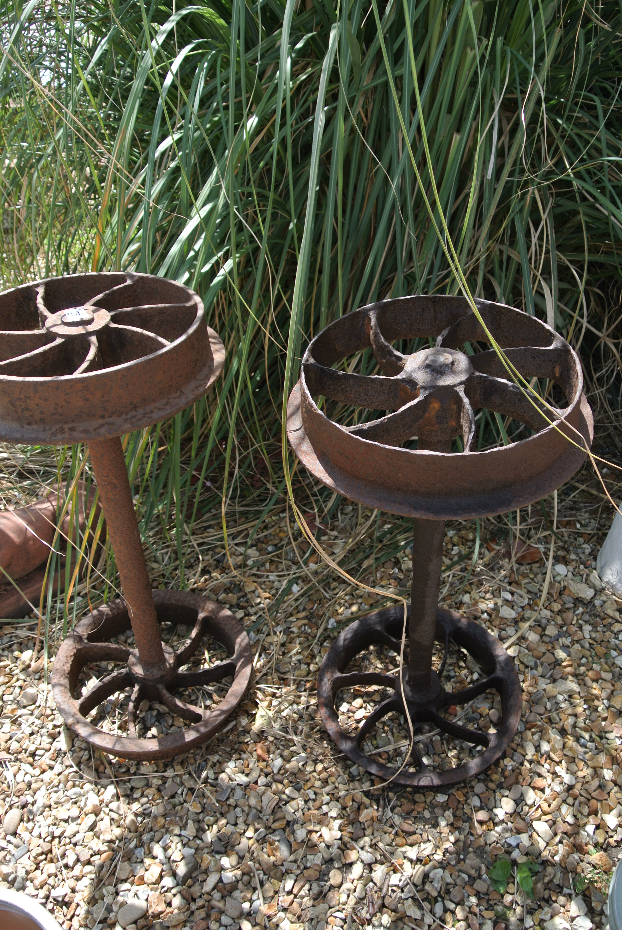 A pair of 19th century cast iron coalmine truck wheels salvaged from a mine near Greymouth,