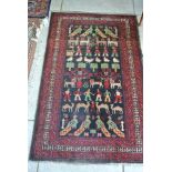 A hand knotted woolen rug with figures,