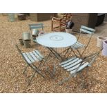 A French style metal work folding table and chair set