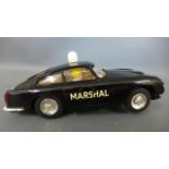 A Scalextric Aston Martin DB4 6T Marshall car - not tested but in good condition with minor marks