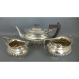 A hallmarked silver tea set - Tea pot,