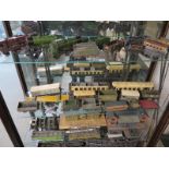 A quantity of O gauge tin plate railway rolling stock including four Locomotives, carriages,