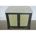 A two door wine cabinet with a marble top over two grill work doors and a fitted wing rack interior