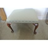 A footstool on shaped legs and pad feet recently re upholstered - Height 37cm x 59cm x 51cm