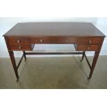 A Georgian mahogany five drawer kneehole writing table recently replaced leather top - width 122cm