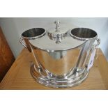 A silver plated two bottle wine cooler