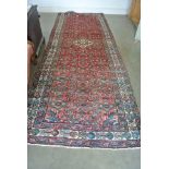 A hand knotted woolen Hamadan rug - 3.45m x 1.