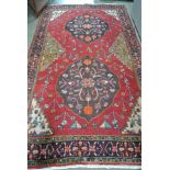 A hand knotted woolen Hamadan rug - 2.54m x 1.