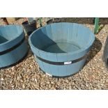 A blue painted wooden planter