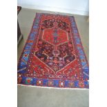 A hand knotted woolen Hamadan rug - 2.38m x 1.