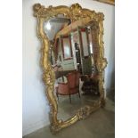 A large ornate late 19th century gilt framed gesso wall mirror - 200cm x 136cm