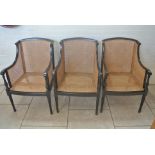 Three ebonised bergere library chairs one with Rowen Boden Ltd,