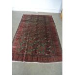 A hand knotted woolen Turkman rug - 1.93m x 1.