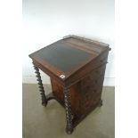 A Regency rosewood writing Davenport opening to reveal a maple fitted interior,