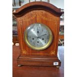 A mahogany and inlaid cased English mantle clock with three train movement,