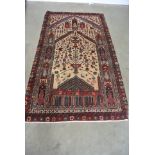 A hand knotted woolen Baluchi rug - 2.03m x 1.