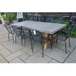 A Bramblecrest concrete/resin table with teak base and ten stacking metal chairs with cushions -